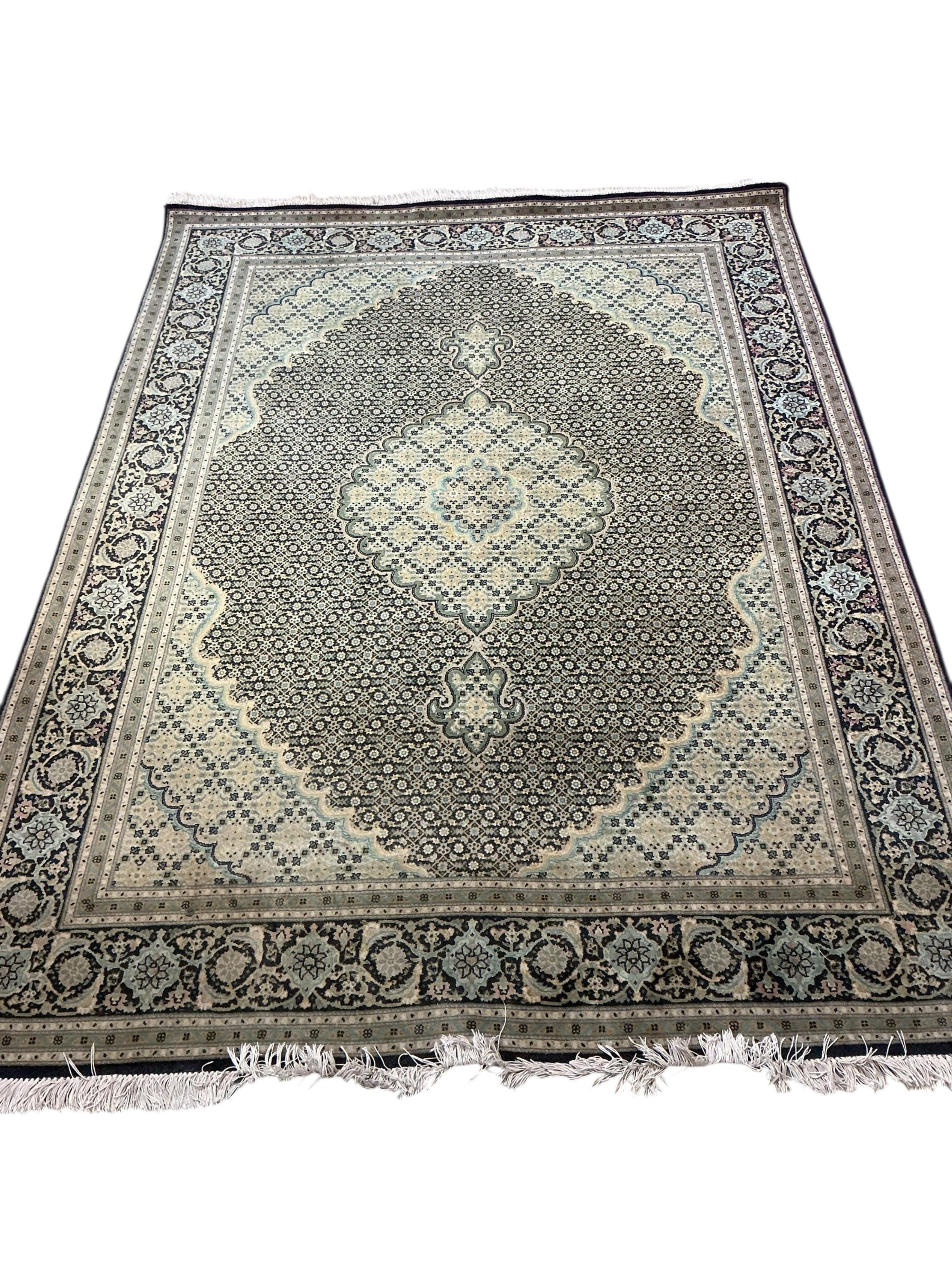 A North West Persian Shiraz blue ground rug, 208 x 153cm